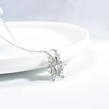 Women’s Silver-Plated Snowflake Necklace charm necklace for cold-season fashion, festive dressing, and gift-ready jewelry use.