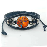 Layered boho Tree of Life charm bracelet with leather bands for trend-forward fashion and everyday wrist wear.