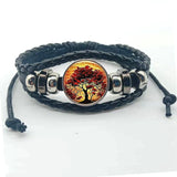 Layered leather Tree of Life charm cuff bracelet for casual outfit accessorizing and daily fashion wear.