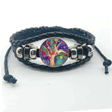 Layered Tree of Life boho bracelet with leather bands for wrist accessorizing, festival fashion, and everyday styling.