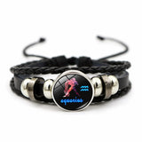 Leather zodiac charm bracelet with 12 signs for horoscope-themed fashion, stacking with bracelets, and everyday styling.