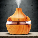 300ml Air Humidifier LED Aroma Essential Oil Diffuser wood grain unit for dispersing essential oils, adding cool mist, and mood lighting.