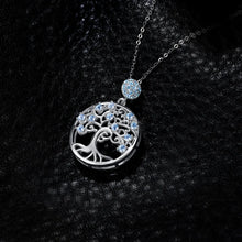 Life Tree gemstone pendant in silver with blue spinel for elegant wear, spiritual jewelry styling, and special occasion gifting.