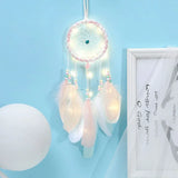 Light up feather dream catcher woven net decor with hanging feathers for wall decoration, sleeping spaces, and boho room accents.