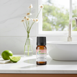 Lime essential oil bottle for aromatherapy, diffuser blends, and uplifting home fragrance use.