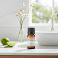 Lime essential oil bottle for uplifting aromatherapy, bright citrus diffuser blends, and cheerful home fragrance.