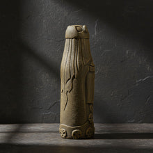 Loki volcanic stone statue side view