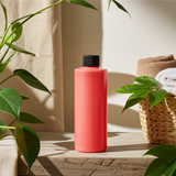 Love Me More body oil bottle for hydrating rough areas, improving skin softness, and daily moisturizing.