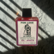 Love Wish Oil bottle of candle dressing oil for romance rituals, altar work, and prayer practice.