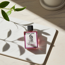 Love Wish Oil ritual oil bottle for love work, candle dressing, and spiritual practice.
