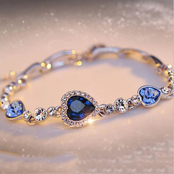 Luxury Blue Crystal Heart Charm Bracelet chain bracelet for fashion styling, gift giving, and special occasion wear.