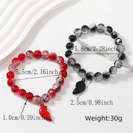 Matching love bracelets with magnetic heart accent and ECG motif for partners to wear for romantic expression, casual outfits, and gift giving.