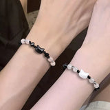 Matching moonstone and obsidian cat bracelets for couples, partner gifting, and everyday symbolic wear.