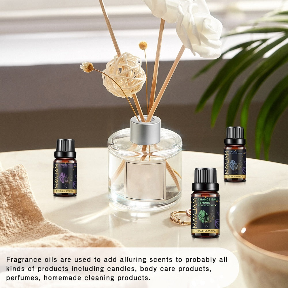 MAYJAM 10ml fragrance oil bottles beside a reed diffuser, shown as scents for candles, body care products and homemade cleaning products.