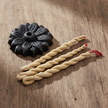 Medicine Buddha Patchouli Incense Ropes burning for relaxation and mindfulness practice.
