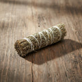 Meditation smudge stick with frankincense, myrrh, and white copal resin for spiritual cleansing rituals.