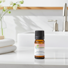 Melissa Essential Oil bottle for calming aromatherapy, anxiety relief diffusing, and creating a soothing indoor atmosphere.