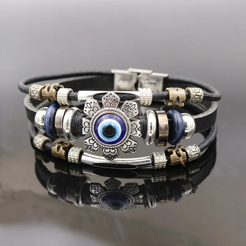 Men’s black leather bracelet with Evil Eye charm for spiritual protection, wrist styling, and daily fashion wear.
