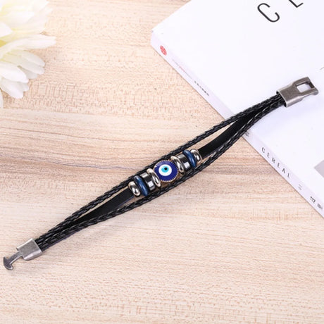 Men’s vintage Turkish evil eye braided leather bracelet for daily accessorizing, symbolic protection, and relaxed outfit styling.