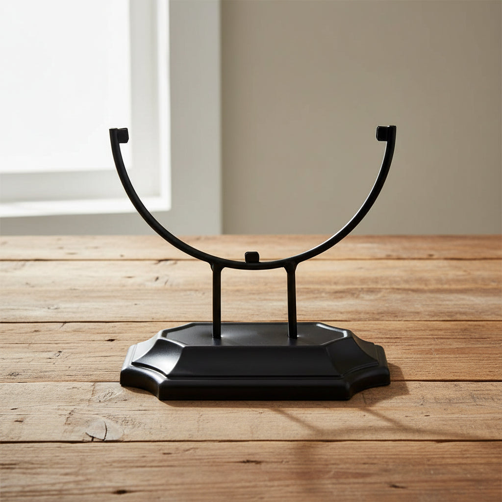 Metal stand for glass suncatchers displayed at an angle, tabletop display base for hanging glass art.