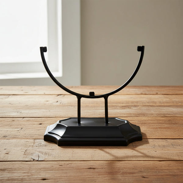 Metal stand for glass suncatchers displayed at an angle, tabletop display base for hanging glass art.