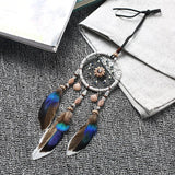 Mini Car Dream Catcher with natural feathers hanging ornament for car mirror decor, spiritual protection, and peaceful travel ambiance.