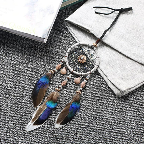 Mini Car Dream Catcher with natural feathers hanging ornament for car mirror decor, spiritual protection, and peaceful travel ambiance.