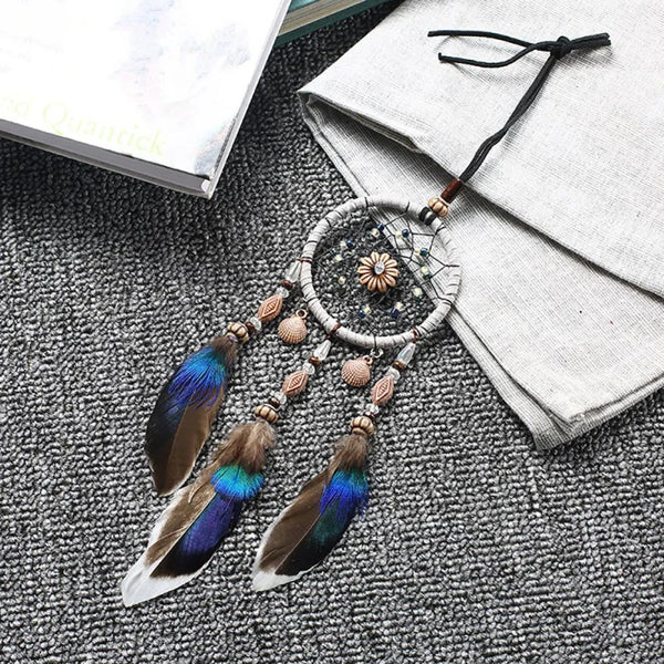 Mini Car Dream Catcher with natural feathers hanging ornament for car mirror decor, spiritual protection, and peaceful travel ambiance.
