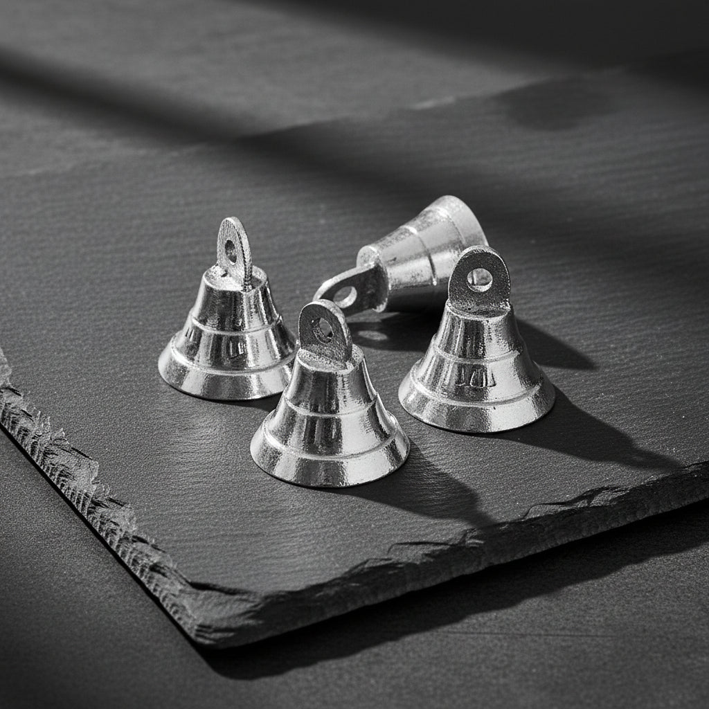 Mini chrome plated brass bell in silver, half inch, for ritual bell ringing, altar use, and energy clearing.