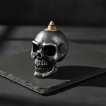 Mini silver skull backflow incense burner for cascading smoke effect, gothic decor, and meditation ambiance.