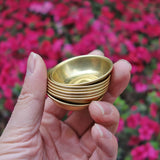 Mini Tibetan brass altar bowl set for ritual water offerings, home shrine use, and daily devotional practice.