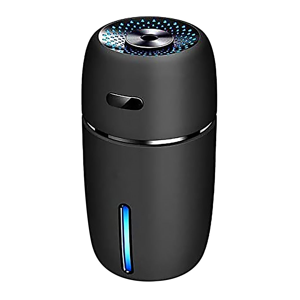 Mini USB air diffuser humidifier with seven color LED light for dry air relief, aroma diffusion, and bedside atmosphere.