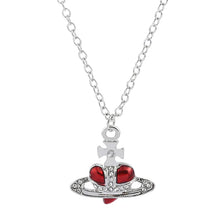 Trendy Silver Heart & Saturn Pendant necklace for minimalist styling, daily fashion use, and versatile outfit pairing.