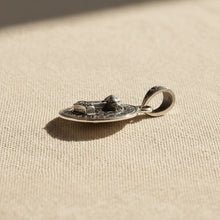 Mjolnir round Viking Norse pendant back view showing engraved detail, Thor's hammer necklace charm.
