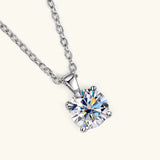 Moissanite pendant necklace with four-prong setting for minimalist styling, everyday elegance, and special events.