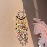 Gold Flame Moon Crystal Sun Catcher hanging decor for catching sunlight, brightening windows, and celestial room decoration.