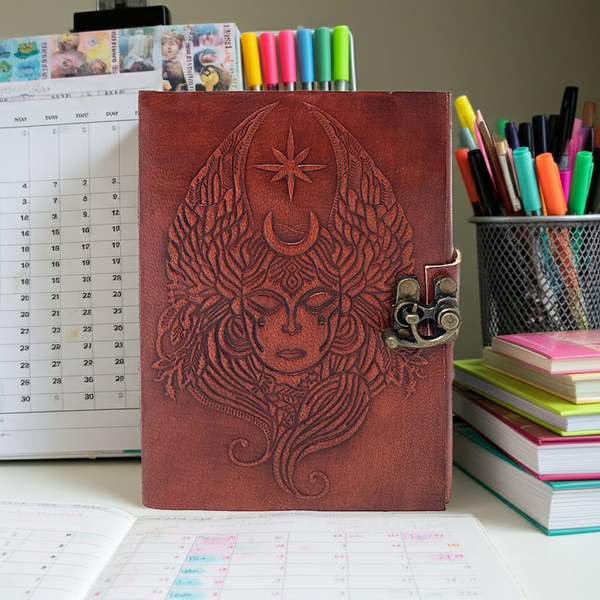 Moon Goddess leather journal with latch closure for writing, journaling, and personal reflection.