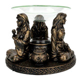 Mother Maiden Crone oil burner close-up detail of carved goddess figures.