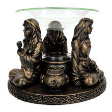 Mother Maiden Crone oil burner close-up detail of carved goddess figures.