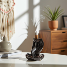Mudra Hand ceramic backflow incense burner for meditation, relaxation, and aromatherapy use.