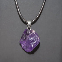 Natural amethyst crystal point pendant with rough gemstone shape for spiritual focus, healing rituals, and everyday accessorizing.