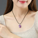 Natural amethyst rough stone pendant with raw crystal form for healing sessions, mindful living, and personal adornment.