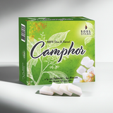 Natural camphor tablets displayed in a lifestyle setting for prayer and ritual cleansing use.