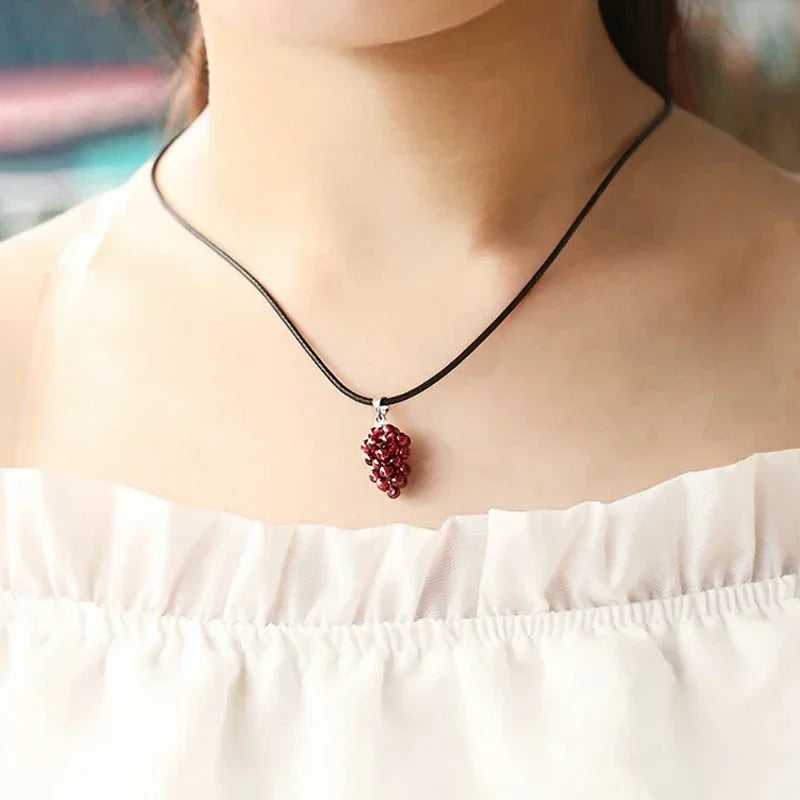 Natural garnet fruit pendant necklace with grape-inspired charm for fashion styling, gifting, and statement jewelry wear.