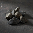 Natural raw lodestone magnetite stone for magnetic ritual work, altar display, and mineral collecting.