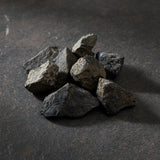 Natural raw lodestone magnetite stone for magnetic ritual work, altar display, and mineral collecting.