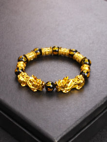 Natural Obsidian Pi Xiu Feng Shui bracelet for abundance, energy shielding, and mindful daily use.