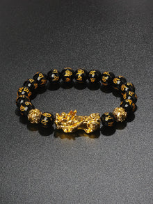 Natural Obsidian wealth Pixiu bracelet for abundance, grounding, and feng shui bracelet use.