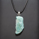 Natural rough purple amethyst pendant with raw gemstone form for crystal healing, mindful meditation, and personal wear.
