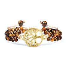 Natural stone Tiger Eye bracelet with charm for boho fashion, gemstone accessory wear, and layered bracelet styling.
